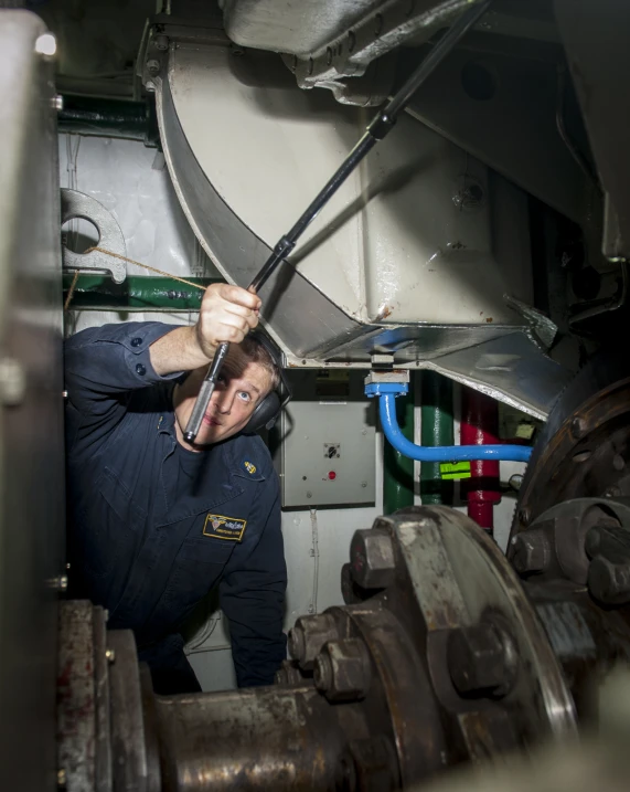 a worker using a plunger to make it work