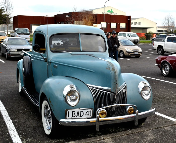 an old car parked on the side of the road