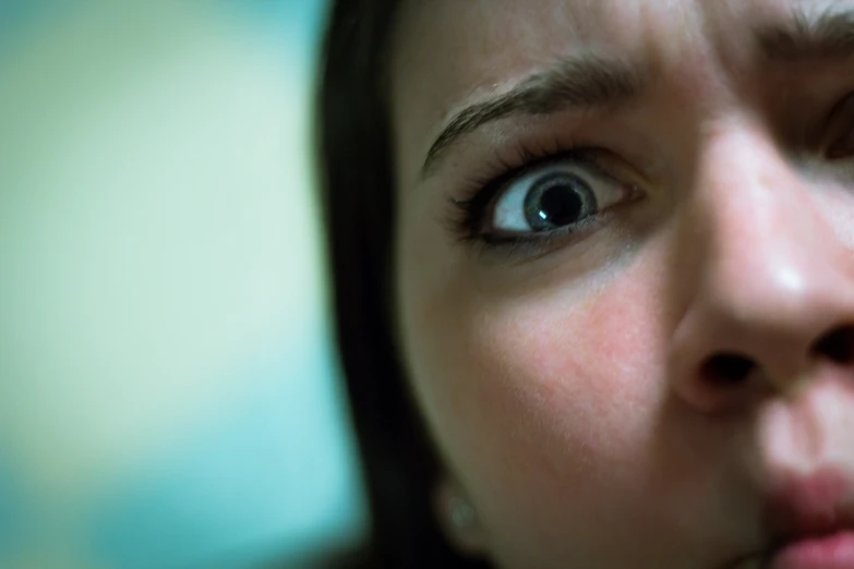 close - up of a woman's eyes with an uncouped expression