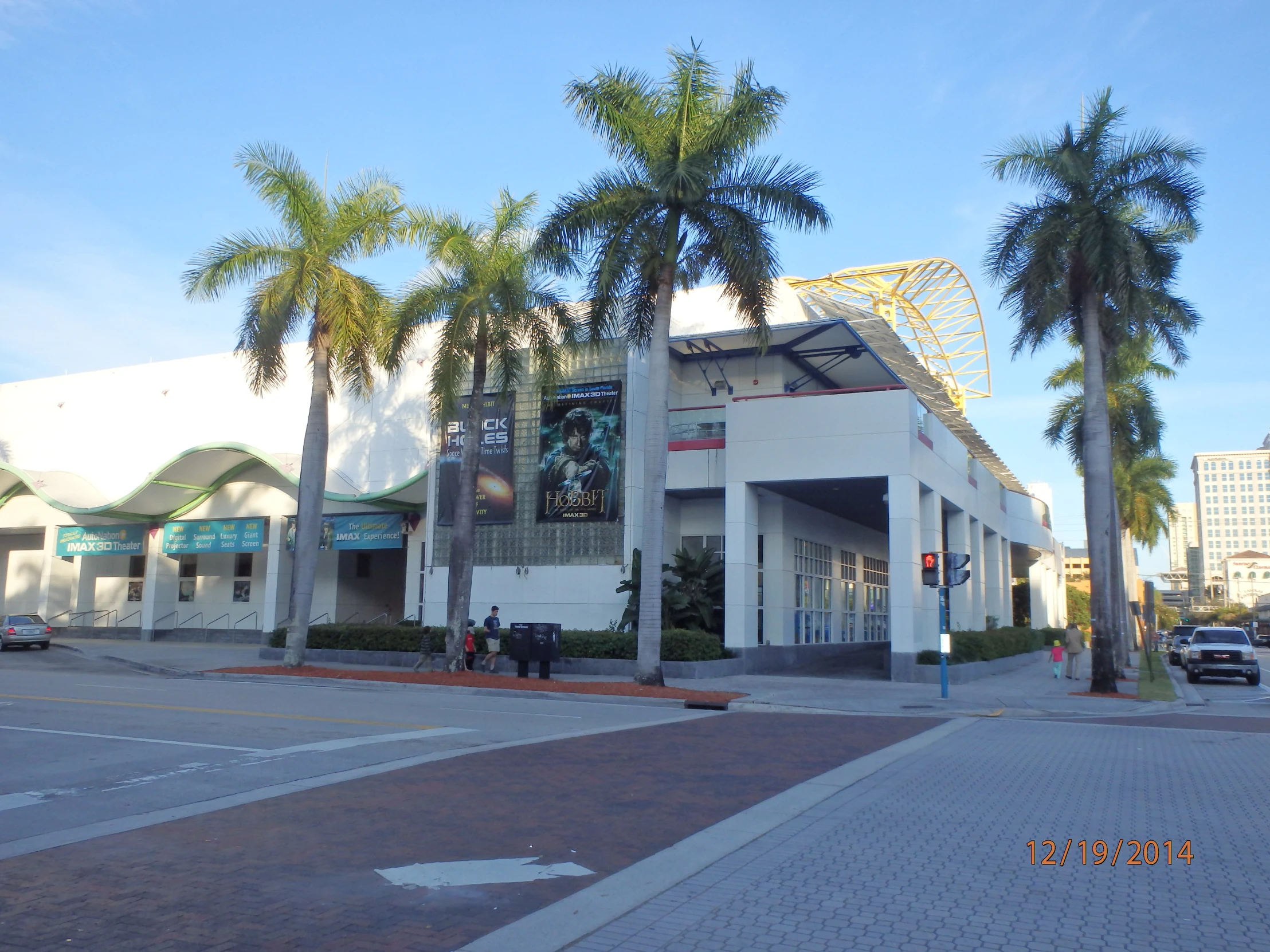 this building is decorated with palm trees and people