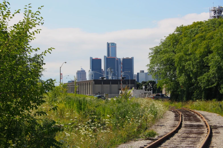 a train track with a view of a city