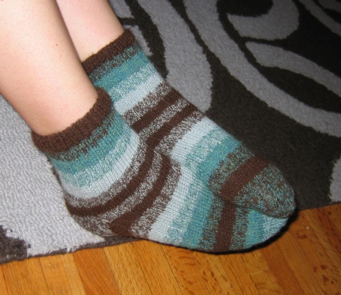 a closeup view of a person wearing two socks