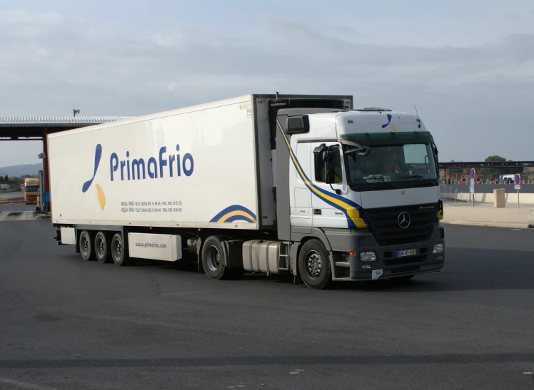 a delivery truck with a blue logo on it