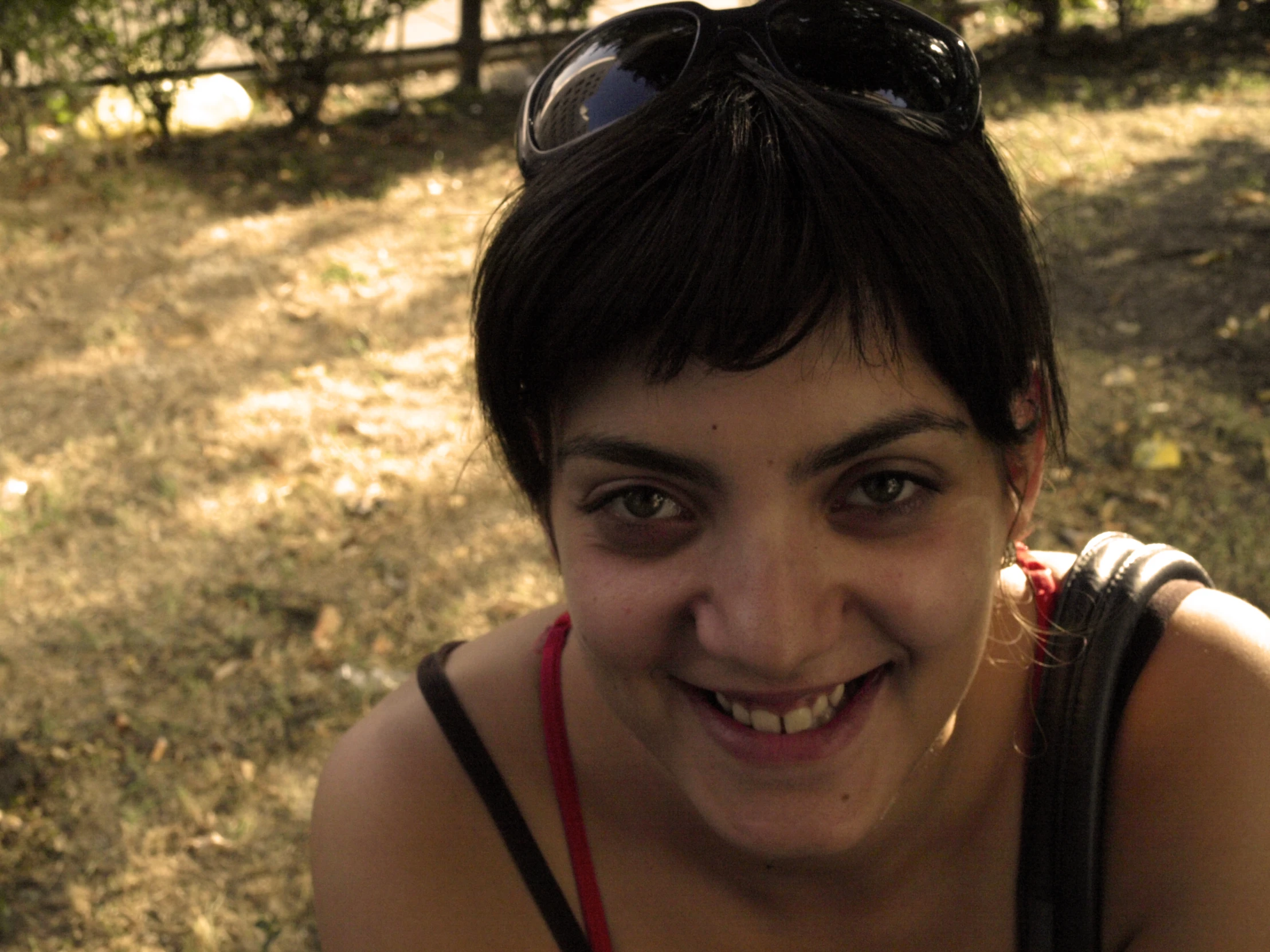 a close up s of a woman posing in front of the camera