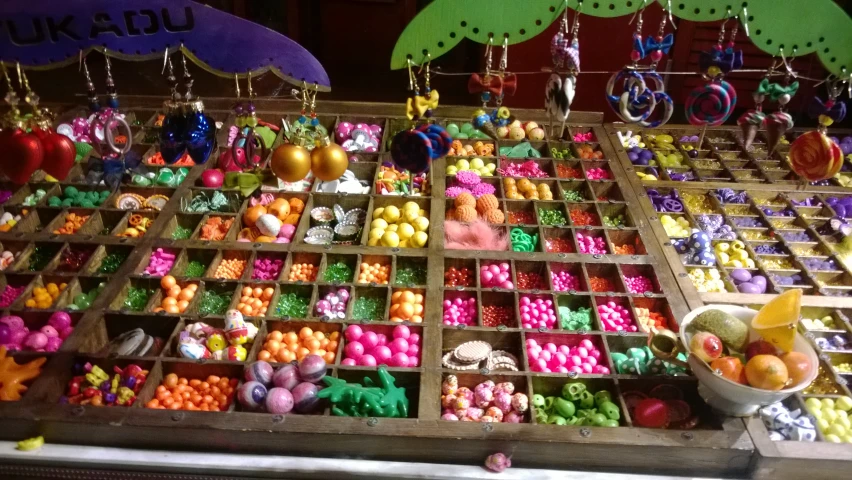 several items in baskets are all covered in colorful beads