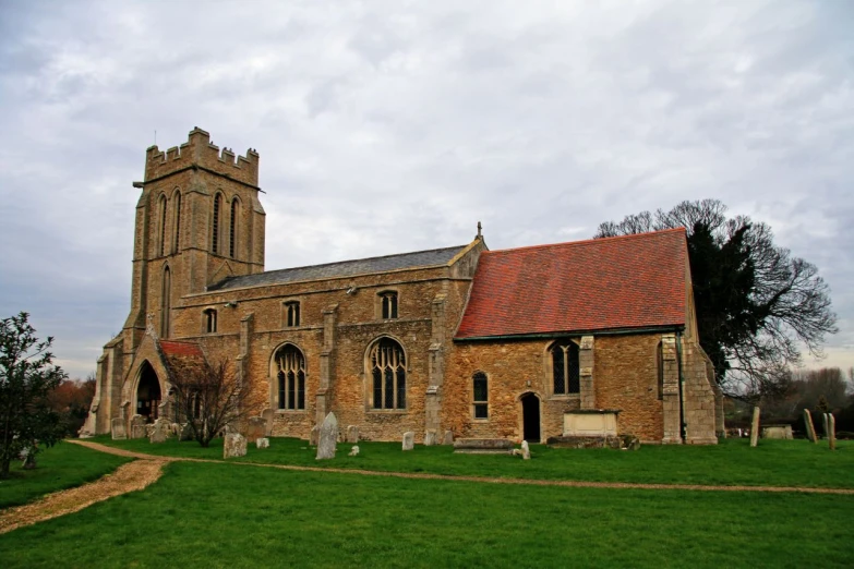 an old church sits in the middle of a cemetery