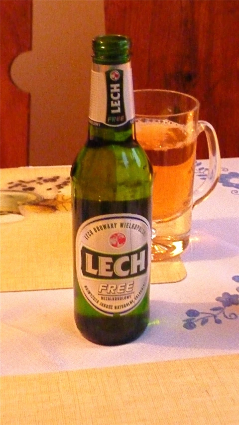 a close up of a bottle of beer sitting on a table