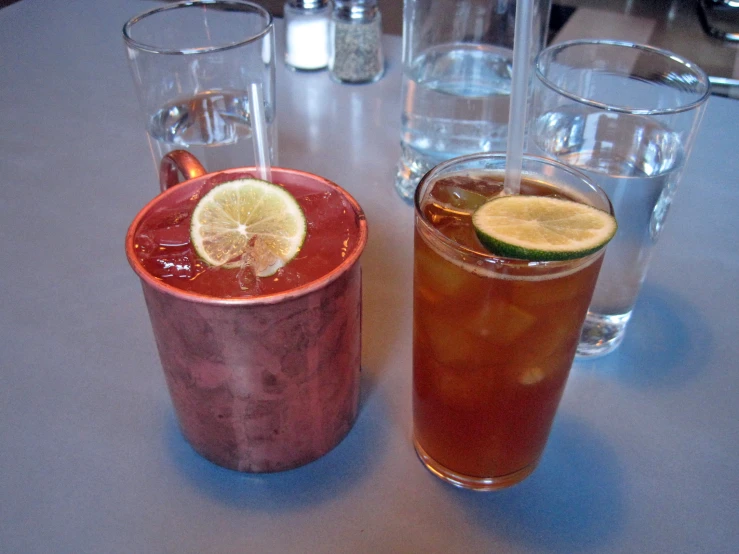 two drinks sitting next to each other on a table