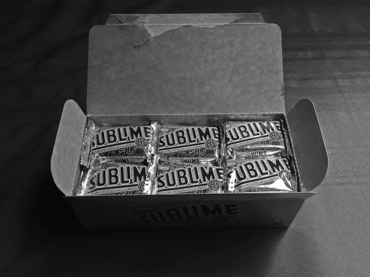 three boxes of gum are opened on a table