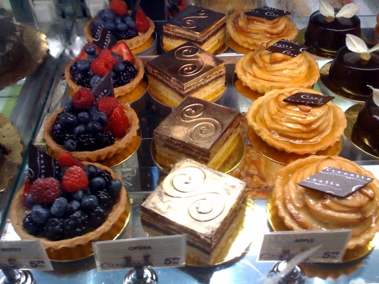 assorted pastries in a glass case for sale
