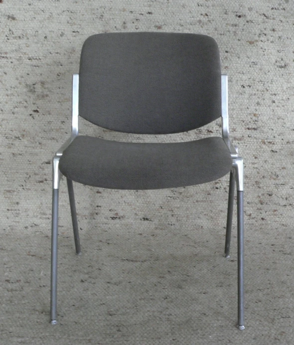a chair with a gray back and chrome frame