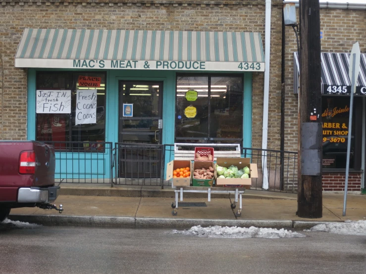 a small truck parked in front of a restaurant