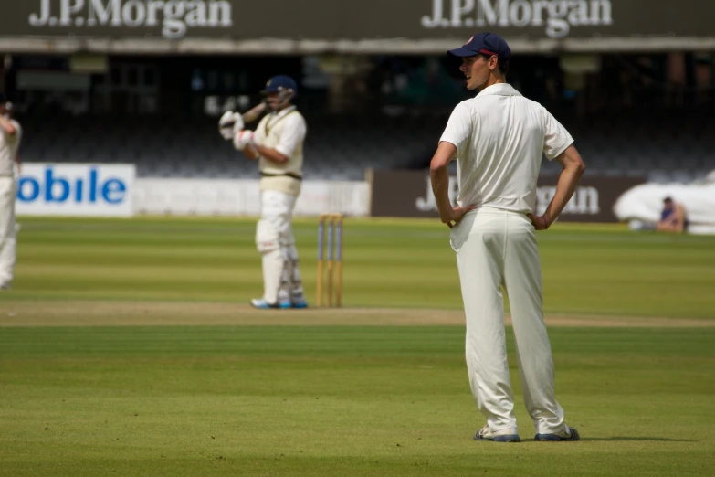 the two men are playing a game of cricket