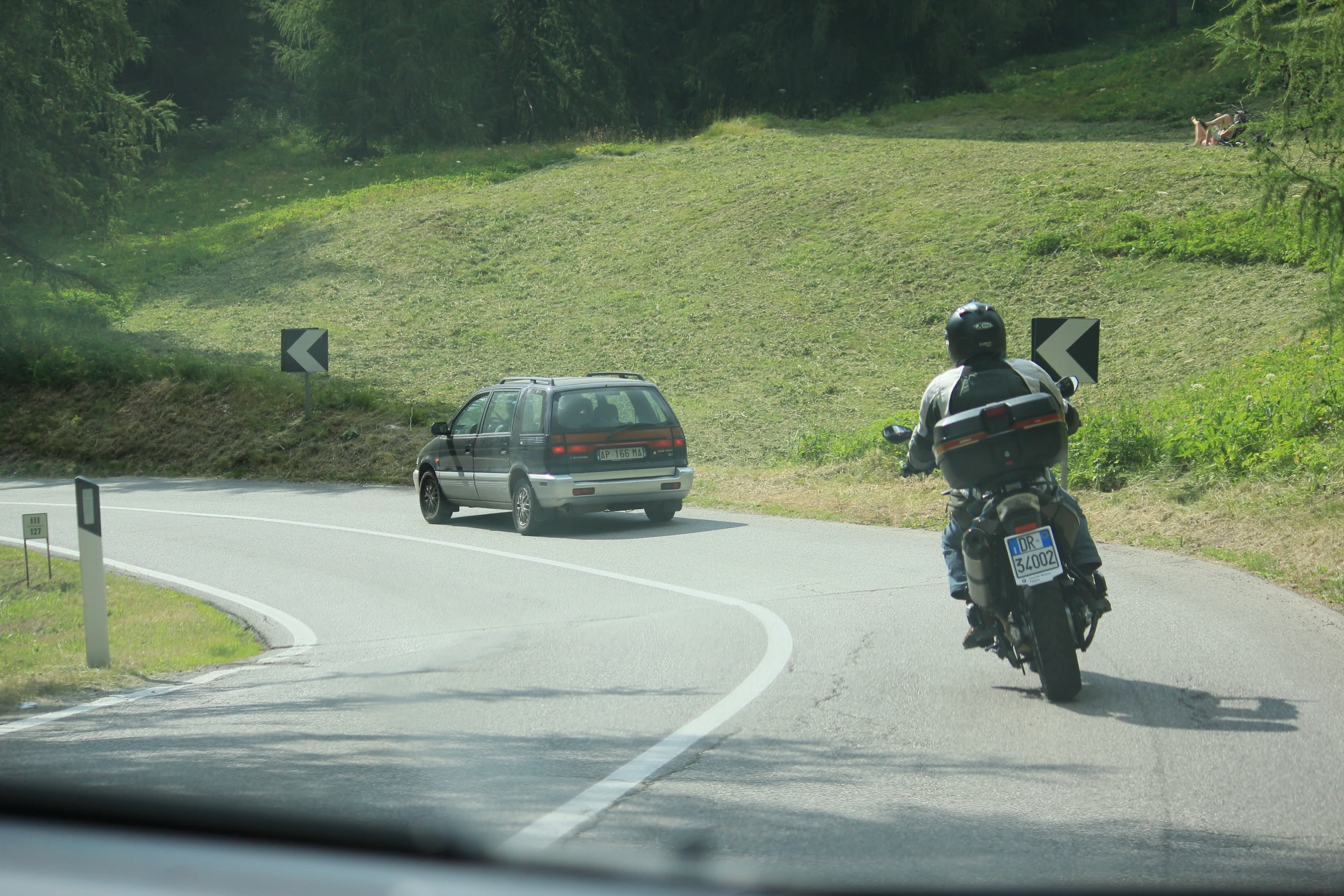 a person riding a motorcycle on the road