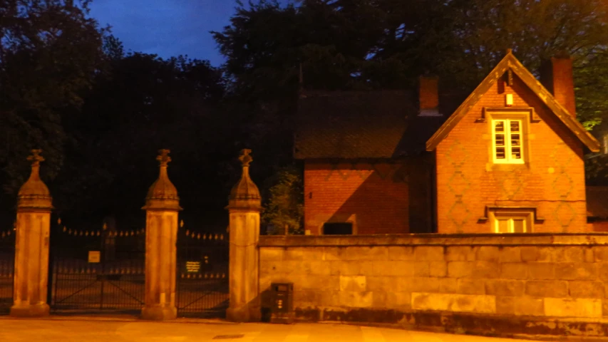 an old brick building with a clock on the front