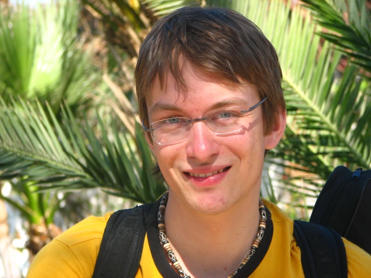 a close up of a person wearing glasses