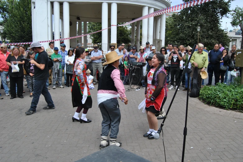 the group is in costume for an outdoor performance