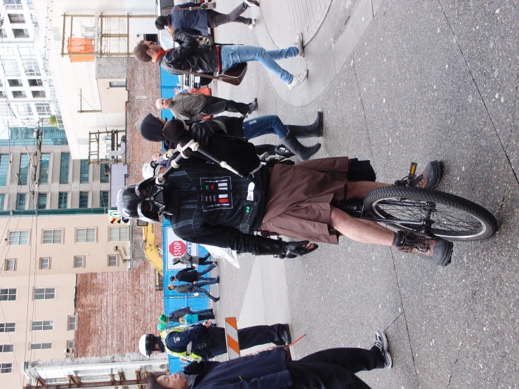 a man riding a bike with a helmet on