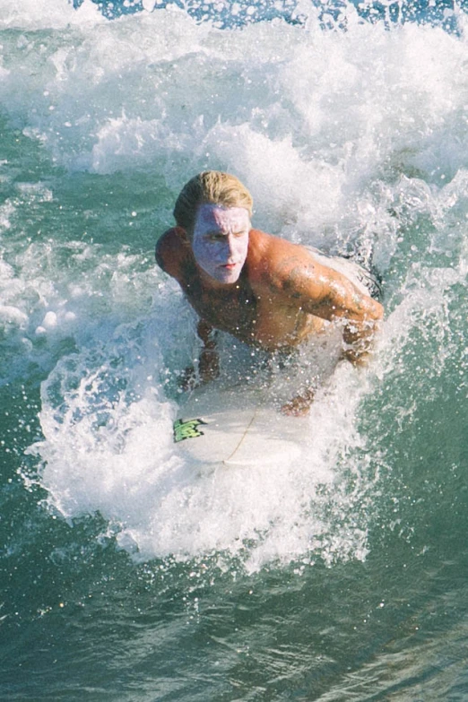 a man is surfing on a white board