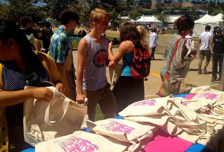 a young person looking at some items on a table