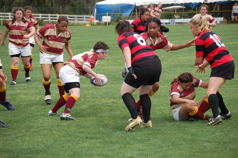 some girls are playing soccer in the field