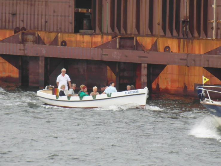 a boat that is holding people on the water