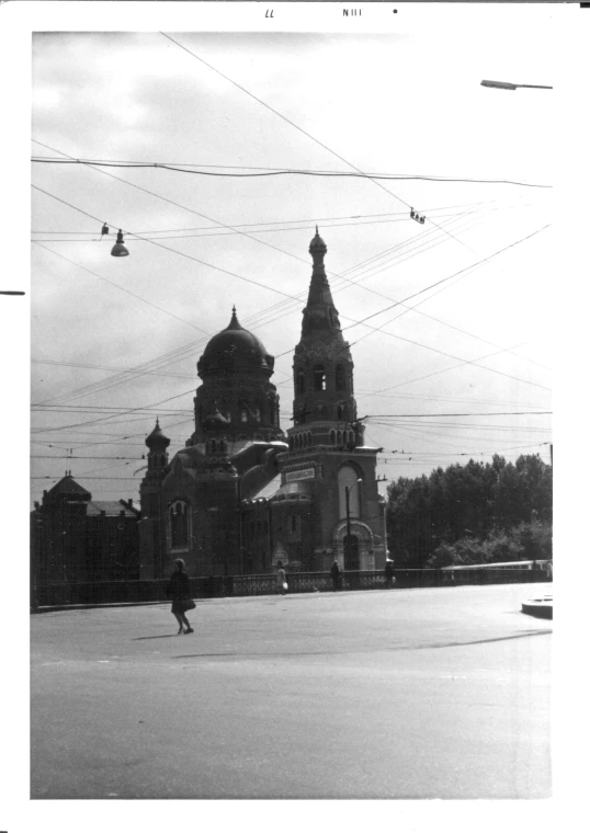 a person standing in front of a large building