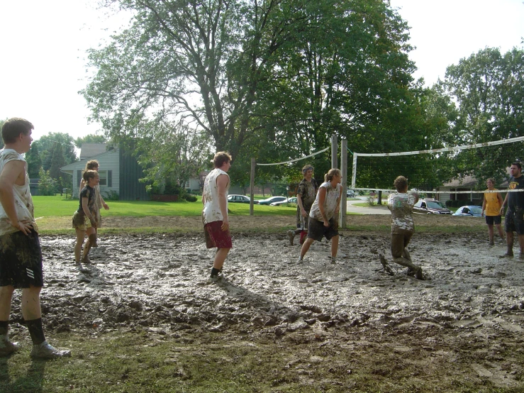 a group of young people playing soccer on the grass