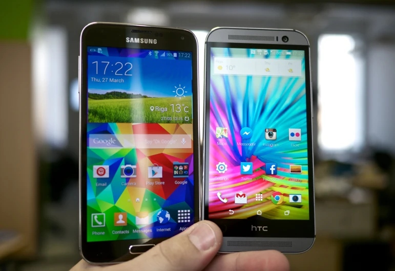 a pair of cellphones showing off their front and back sides