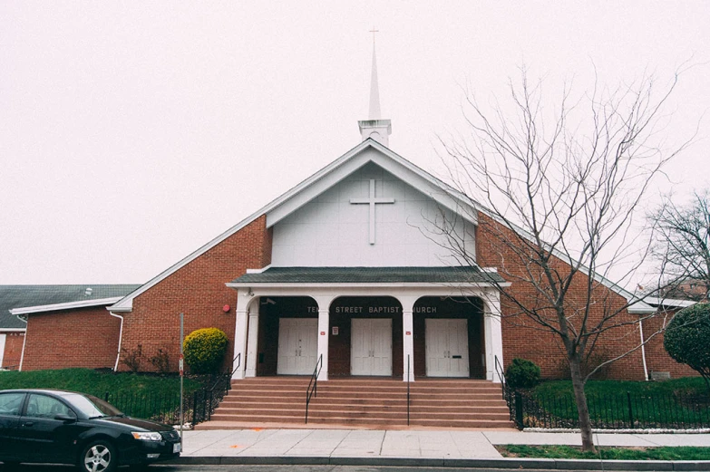 a car that is parked outside of a church