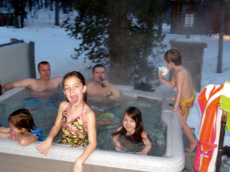 s swimming and playing in the bathtub