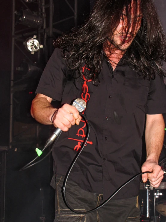 a guy in the audience with an electric microphone