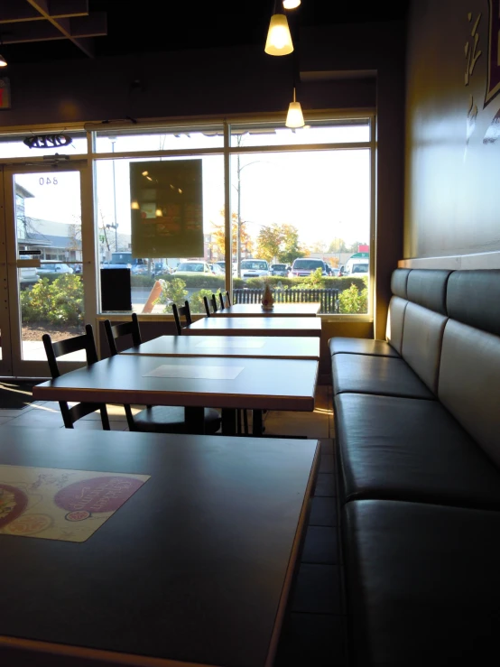 a large restaurant with tables set for people