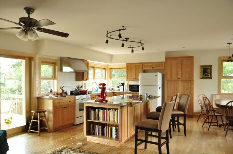 a kitchen with island, table and a stove