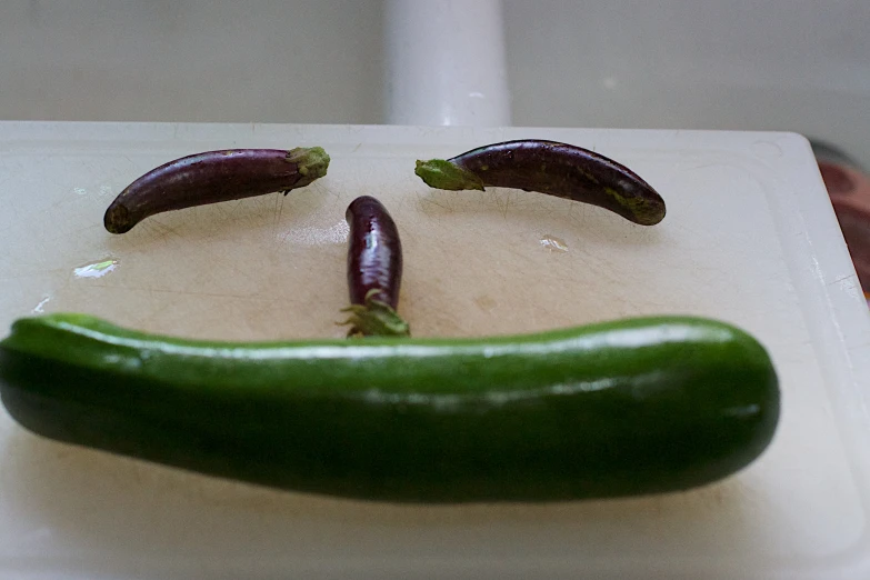 a piece of vegetable with one face drawn on it