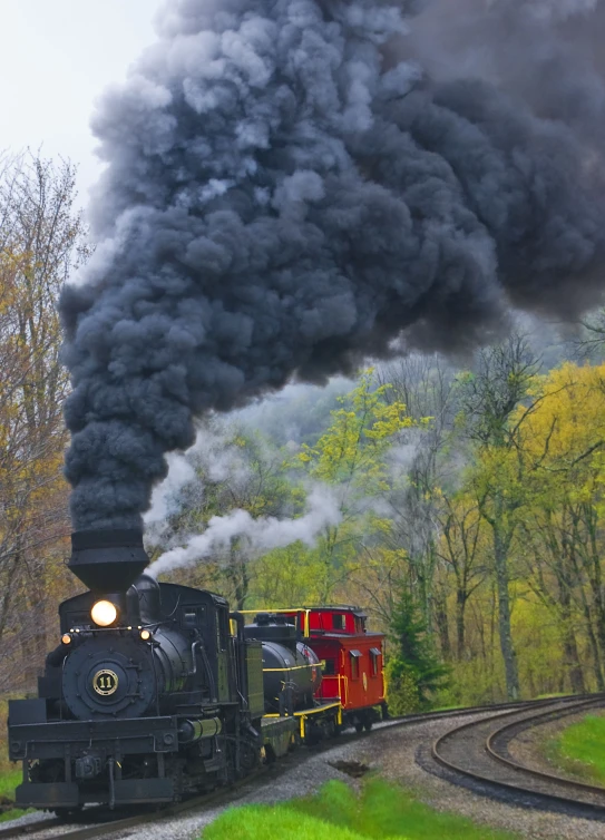 there is a train that has smoke billowing out