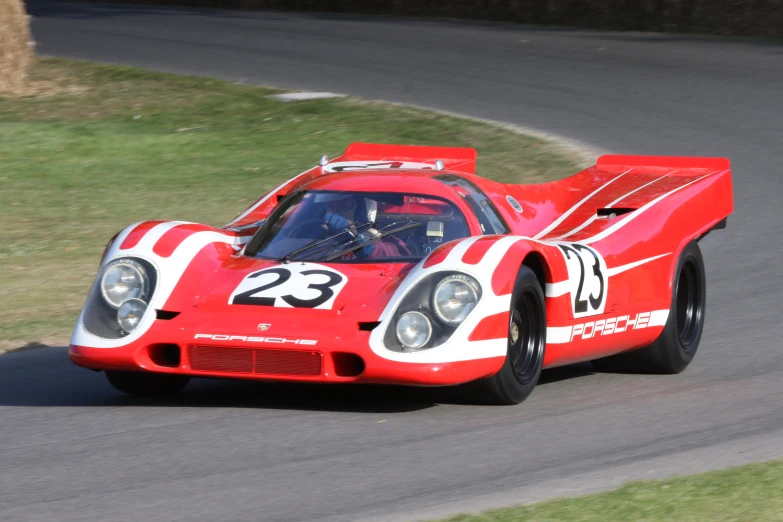 the older race car is driving on the track