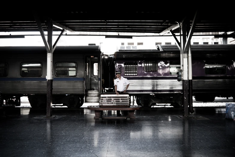 a train is parked in an indoor platform area