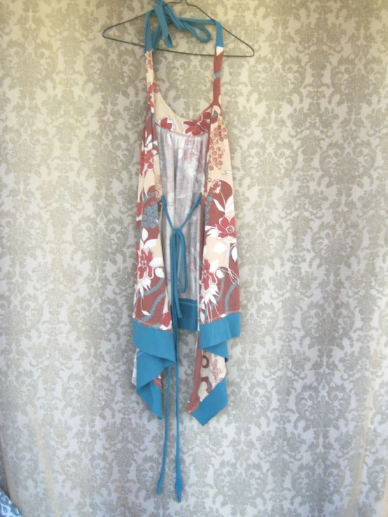 a dress hanging up on a clothes hanger