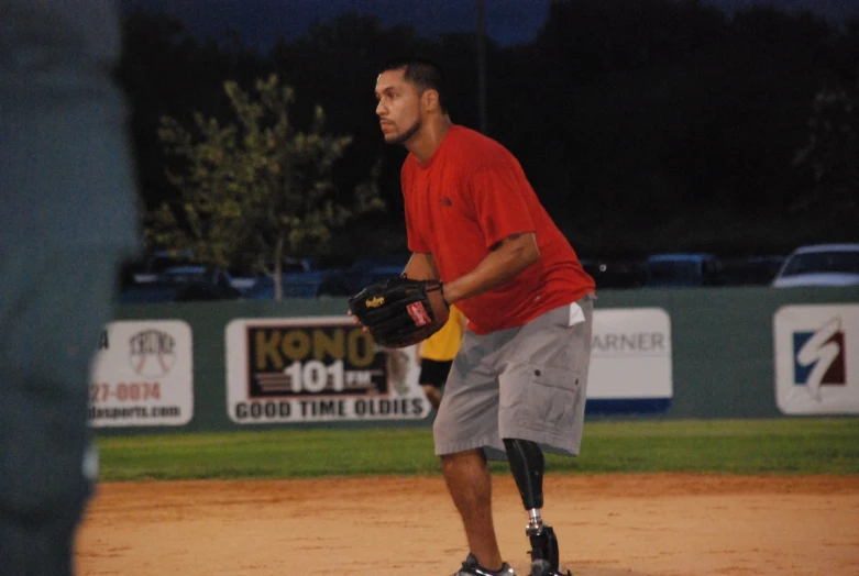 the man with the glove is walking on the field