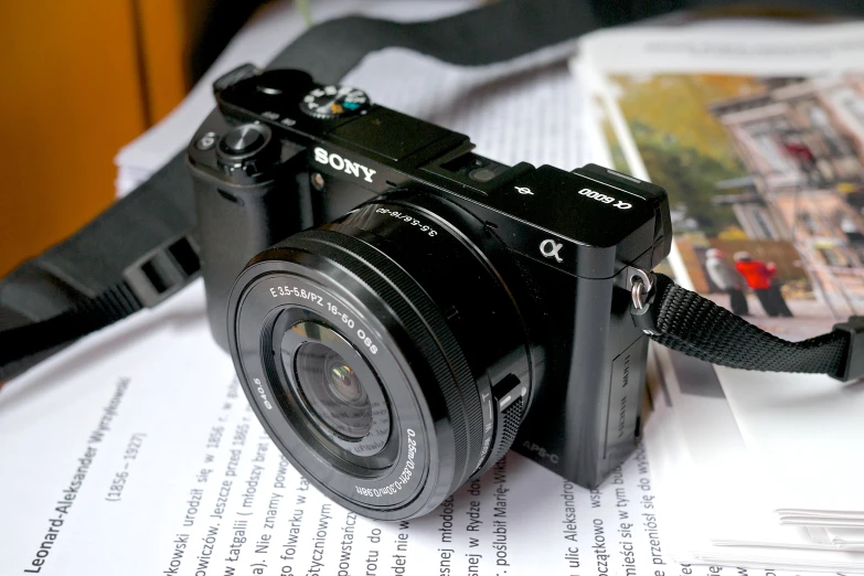 a camera sitting on top of a piece of paper