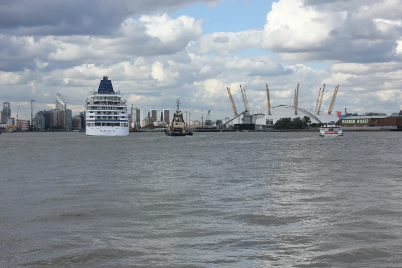 the big boat is driving past an island