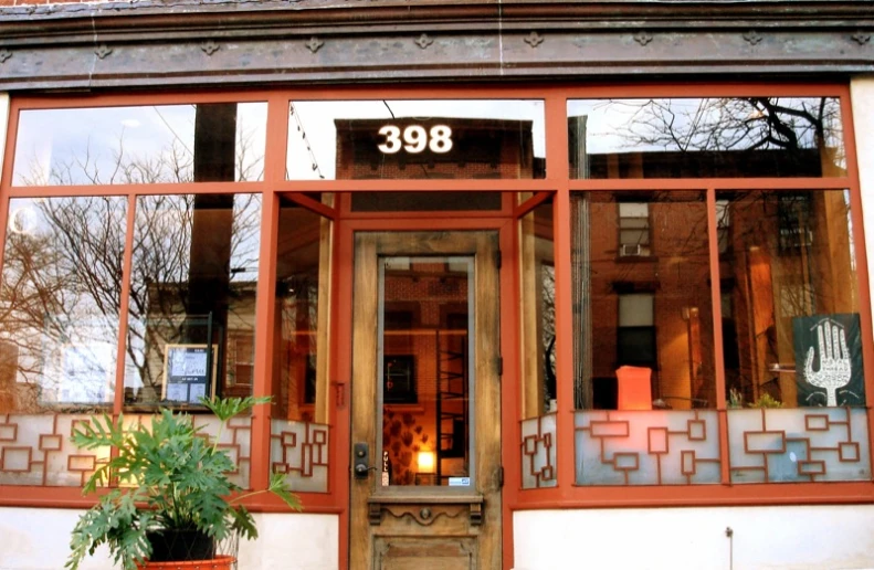 a large building with red windows and an entrance