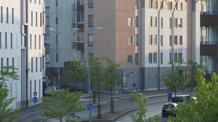 street scene from a roof top with cars parked nearby