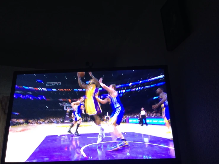 basketball game on an electronic television screen with a player playing basketball