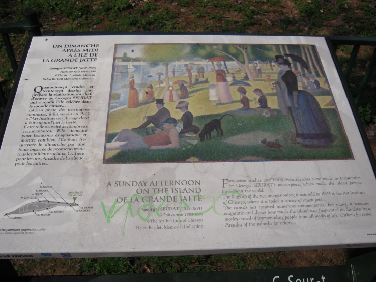 a sign at the park describing paintings of women sitting in a grassy park