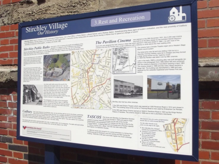 information panel on brick building showing street names and locations