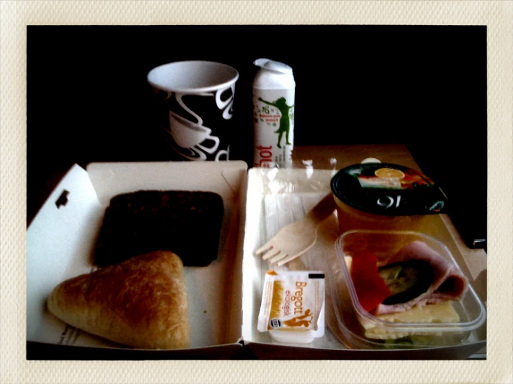 a view of a meal with a cup and two other items on it