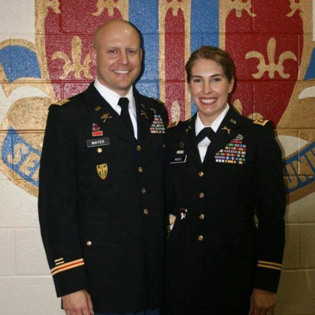 a man and woman in military uniform standing together