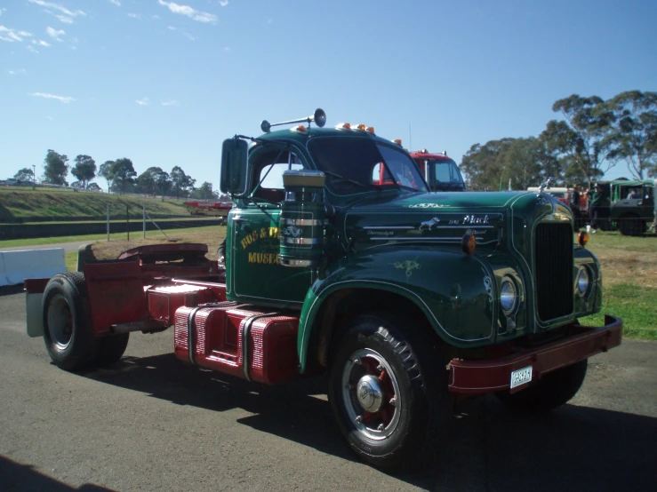 a green and red semi truck is parked